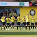 Harrogate Town's players line up before Saturday's League Two clash with Stockport County to observe a minute's silence in support of all those impacted by the earthquakes in Turkey and Syria earlier this week. Picture: Matt Kirkham