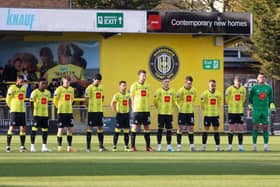 Harrogate Town's players line up before Saturday's League Two clash with Stockport County to observe a minute's silence in support of all those impacted by the earthquakes in Turkey and Syria earlier this week. Picture: Matt Kirkham