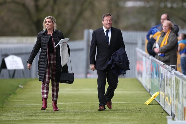 John Radford and Carolyn Radford walk beside the pitch ahead of a game with Northampton in December 2019. COVID would strike a few months later leaving the Radford's needing to dig deep and steer Stags through a crisis.