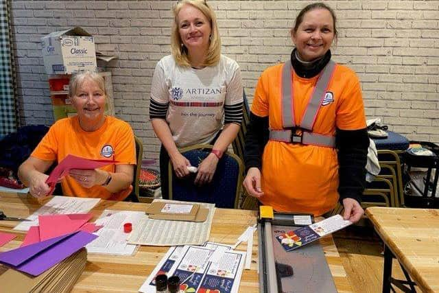 Community Fit volunteers helping prepare crafts with Susie Hart of Artizan