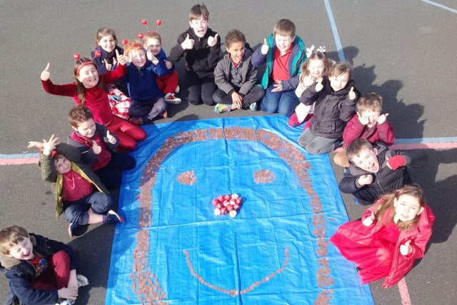 Pupils from Embleton Vincent Edwards Primary School celebrated Red Nose Day in 2017 by making a giant penny smiley face.
