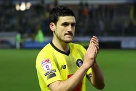 Anthony O'Connor applauds Harrogate Town's travelling support following Saturday's 1-0 win at Carlisle United. Pictures: Matt Kirkham