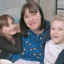 Brave Harrogate seven-year-old Archie Flintoft, right, with his mum Vicky and sister Holly after this 100th life-saving blood transfusion.