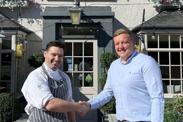 The Wild Swan's co-owner Stephen Lennox, pictured right,  with the Harrogate district head chef Paul Murphy outside the bar-restaurant in Minskip.