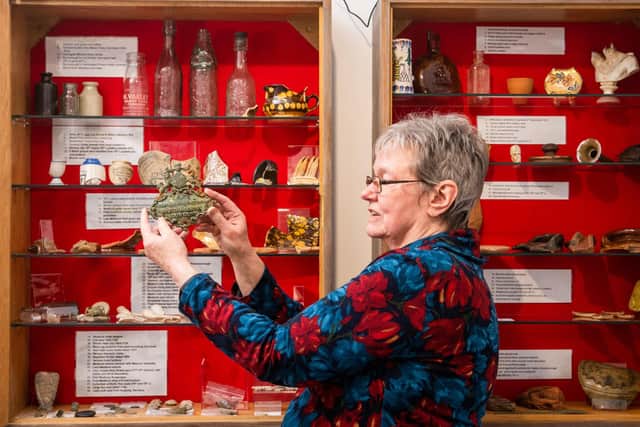 Knaresborough Heritage Centre is full of fascinating history - Ruth Bulmer, Volunteer Co-ordinator, of Knaresborough Museum Association, holding a shield from a Victorian knife sharpener. (Picture James Hardisty)