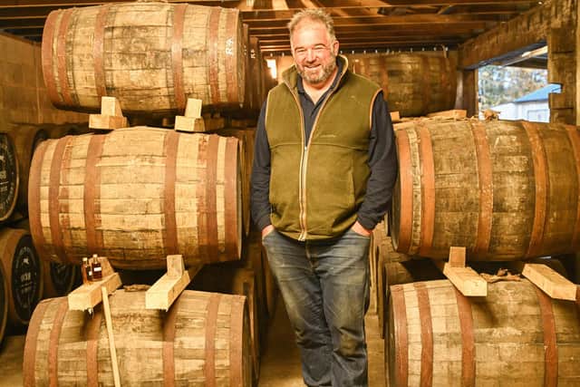 Pictured: Toby Whittaker amongst the aging barrels at Whittaker's Distillery.