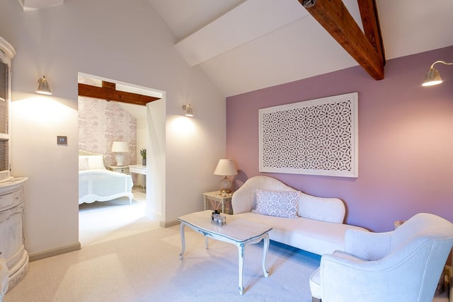 A stunning bedroom suite with open vaulted ceilings.