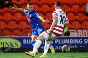 Jack Muldoon delivers a dangerous ball into the Doncaster Rovers box during Harrogate Town's 2-0 win at the EcoPower Stadium. Picture: Matt Kirkham