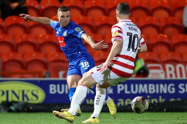 Jack Muldoon delivers a dangerous ball into the Doncaster Rovers box during Harrogate Town's 2-0 win at the EcoPower Stadium. Picture: Matt Kirkham