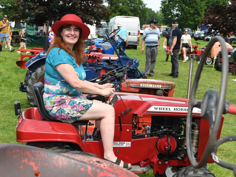 Mary Walton sat on her Wheel Horse C125 in the sunshine at Newby Hall