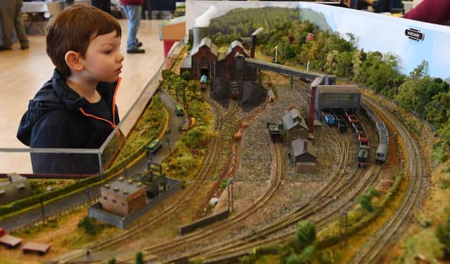 Sebastian Powley watches one of the locomotives trundle around the exhibit at a recent Harrogate Model Railway Group exhibition at St Aidan's C of E School, Harrogate.