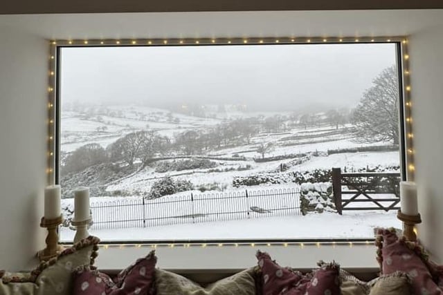 A gorgeous view of the snow from a living room window