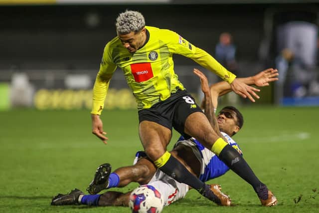 Dior Angus in action for Harrogate Town against Colchester United.