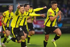 Jack Muldoon, right, celebrates after heading Harrogate Town into a 24th-minute lead against Wrexham at Wetherby Road. Pictures: Matt Kirkham