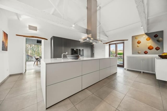 A deluxe modern kitchen with central island.