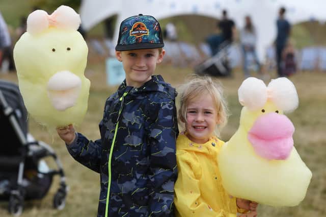 Finn Gibson (aged seven) and his sister Mia Gibson with their candyfloss animals