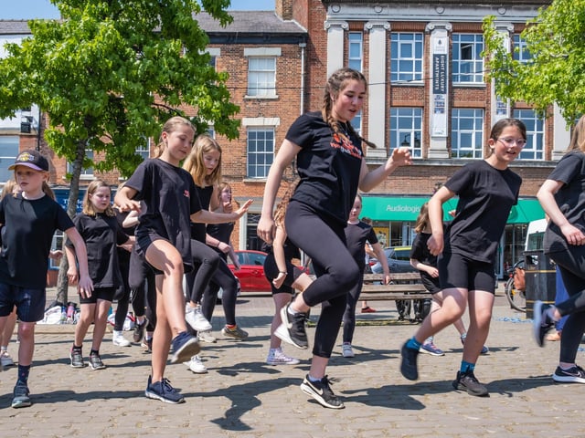Young dancers on Ripon's market square pull off their best performance. Street performers in partnership with Little Bird Artisan Market