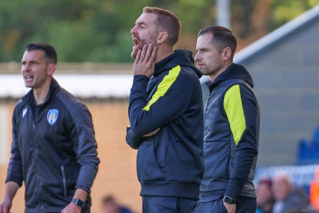 Harrogate Town manager Simon Weaver and his assistant, Paul Thirlwell, right, watch on from the sidelines during Saturday's 2-1 League Two loss at Colchester United.