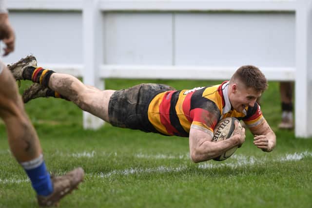 Rupert Scrase dives over the whitewash to register Harrogate's first try of the afternoon.