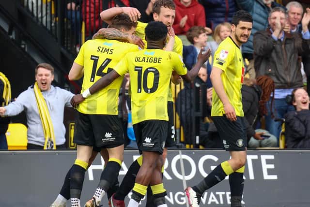 Harrogate Town players celebrate Tom Eastman's 60th-minute equaliser against Doncaster Rovers.