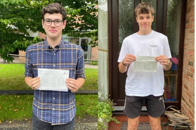 Theo Kendrick and Daniel Brown collect their GCSE results with pride