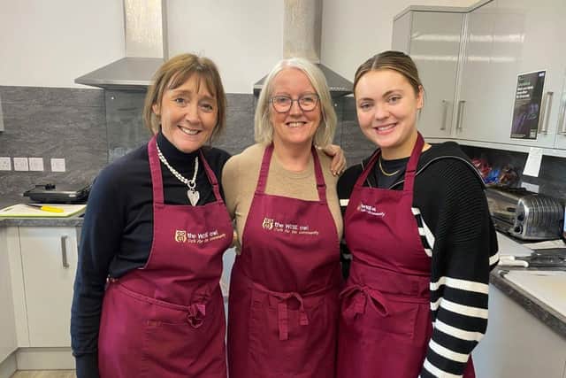 Isabelle – far right, with café manager Christine (left), and volunteer, Margaret.
