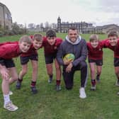England rugby union star Zach Mercer with some young fans from Ashville Senior School in Harrogate.