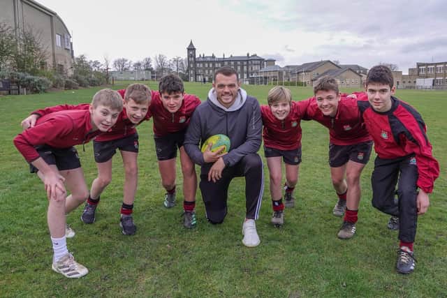 England rugby union star Zach Mercer with some young fans from Ashville Senior School in Harrogate.