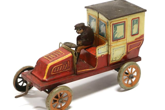A charming clockwork Bing Taxi sold for £600.