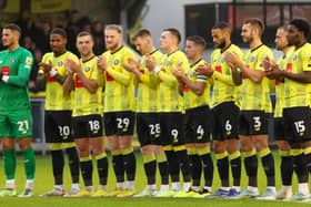 Harrogate Town players join in a minute's applause held in memory of Sulphurites supporter Johnny Walker before Saturday's League Two clash with Mansfield Town. Picture: Matt Kirkham