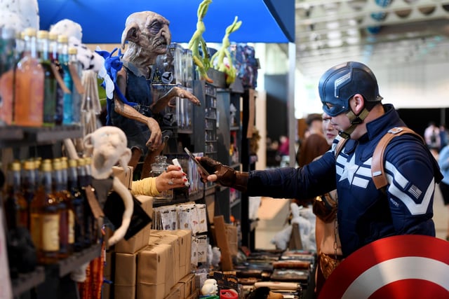 Captain America taking a look at the merchandise that is on offer