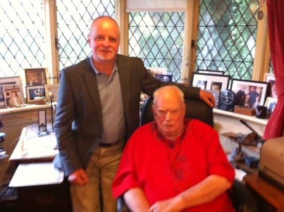 Dr Keith Souter with Sir Patrick Moore in his study.