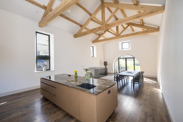 The kitchen island, and bright and airy dining space.