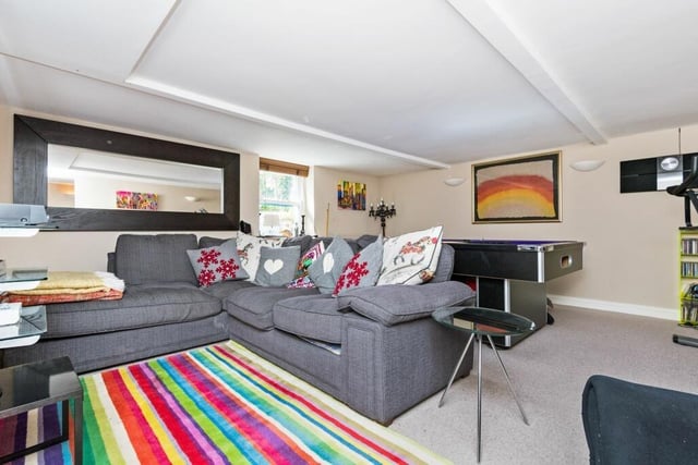 A family room with comfortable seating and games section.