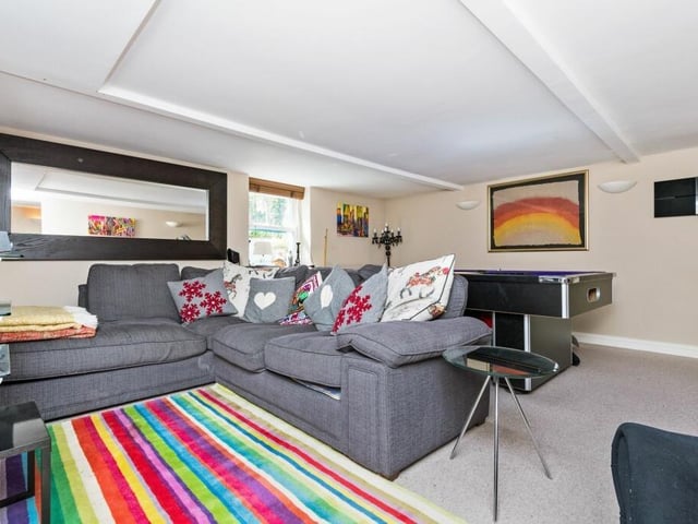 A family room with comfortable seating and games section.