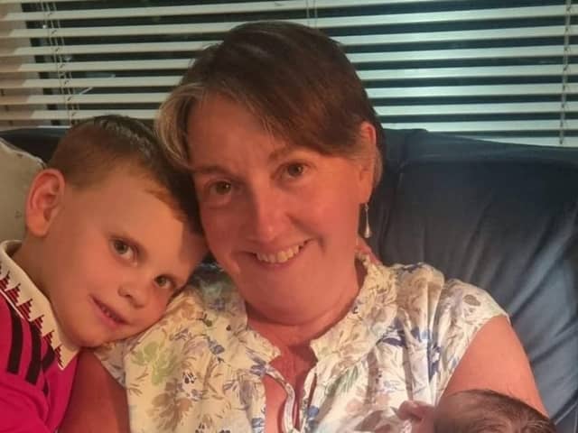 Pictured with her grandchildren is Harrogate resident Angie Russell who is set to swim the 22 miles over 12 weeks to raise funds for Aspire, which supports people with Spinal Cord Injury. (Picture contributed)