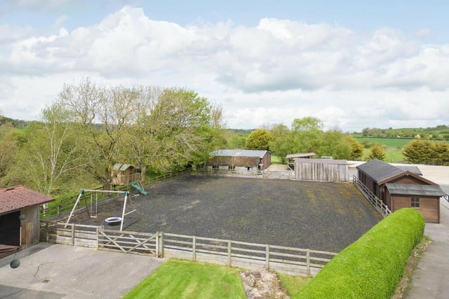 There are equestrian facilities and a commercial yard with the property.