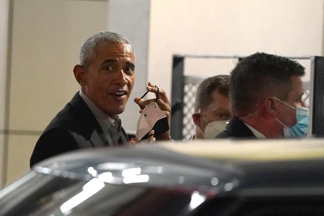 Former US president Barack Obama leaves the University of Strathclyde in Glasgow during the Cop26 summit.