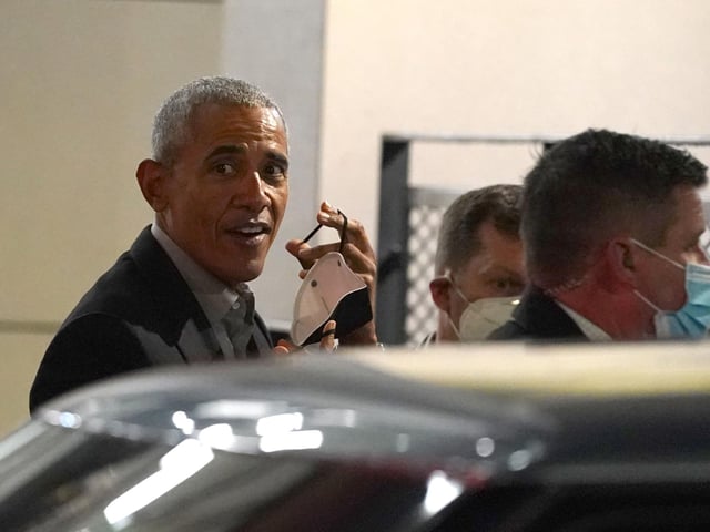 Former US president Barack Obama leaves the University of Strathclyde in Glasgow during the Cop26 summit.