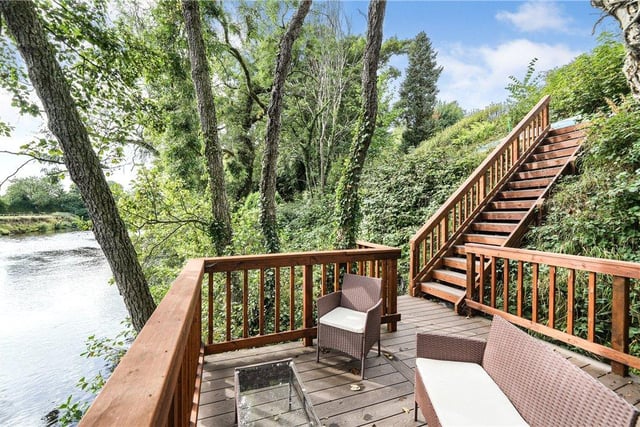 This decked area overlooking the river is a perfect place to sit and unwind.