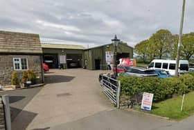 Councillors have delayed making a decision on expanding a garage near the village of Hampsthwaite in Harrogate