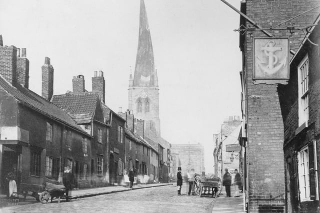 This shot shows the town's famous Crooked Spire back in 1874.