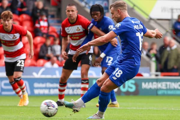 Jack Muldoon converts from the penalty spot to fire Harrogate Town to victory at Doncaster Rovers. Pictures: Matt Kirkham