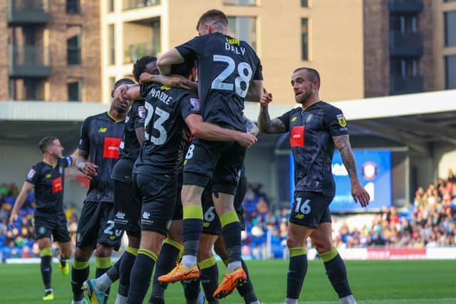 Harrogate Town looked on course for victory at AFC Wimbledon after Rory McArdle handed them a 65th-minute lead.