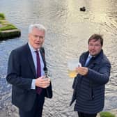 Yorkshire Water's biggest ever investment in environment - Andrew Jones MP and Frank Maguire, owner of Knaresborough Lido, looking at a sample of the water in the Nidd. (Picture contributed)