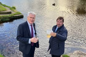 Yorkshire Water's biggest ever investment in environment - Andrew Jones MP and Frank Maguire, owner of Knaresborough Lido, looking at a sample of the water in the Nidd. (Picture contributed)