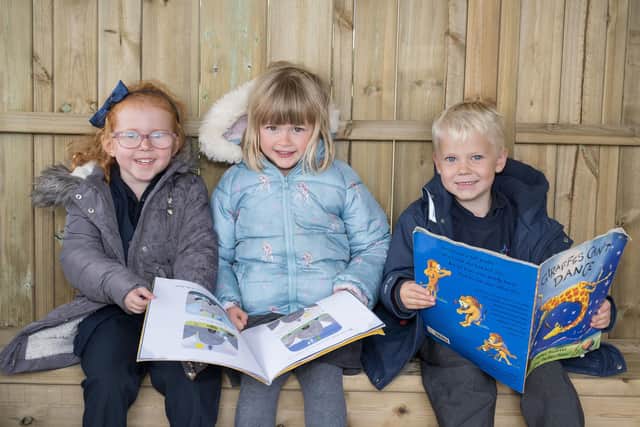 Children at Hookstone Chase Primary School enjoy an alfresco story time in the new purpose-built play area