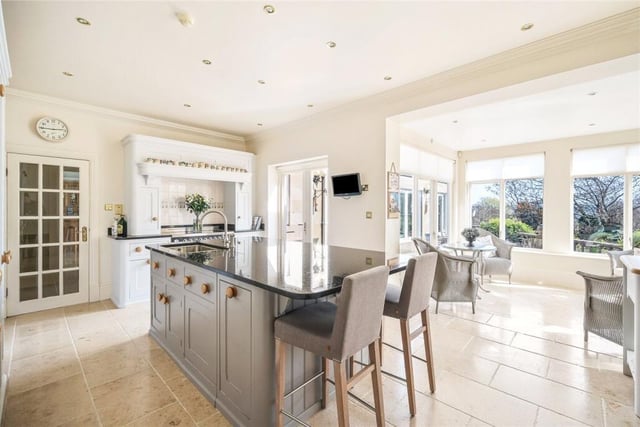 A very well equipped, modern family kitchen is bright and airy.