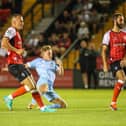 James Daly fires Harrogate Town into a 2-0 lead against Lincoln City at Sincil Bank. Pictures: Matt Kirkham