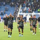 Harrogate Town's players applaud their travelling supporters following Saturday's 1-0 victory at Colchester United. Pictures: Matt Kirkham